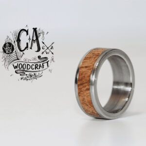 C A Woodcraft Wood and stainless steel ring with African Rosewood. Hand made wooden jewellery